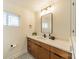 Stylish bathroom with a modern vanity and a patterned floor at 531 Manhasset Rd, Charlotte, NC 28209