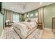 Relaxing bedroom with soft linens and a calming green accent wall at 531 Manhasset Rd, Charlotte, NC 28209