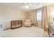 Charming Bedroom with floral wallpaper and a neutral color scheme at 531 Manhasset Rd, Charlotte, NC 28209