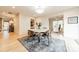 Modern dining room with a round table and stylish chairs, hardwood floors at 531 Manhasset Rd, Charlotte, NC 28209