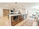Open-concept kitchen featuring an island with stainless steel appliances and views of the living area at 531 Manhasset Rd, Charlotte, NC 28209
