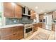 Modern kitchen with stainless steel appliances and dark wood cabinets at 531 Manhasset Rd, Charlotte, NC 28209