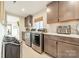 Bright laundry room with modern appliances and ample cabinetry at 531 Manhasset Rd, Charlotte, NC 28209