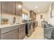 Clean laundry room, featuring modern appliances and stylish cabinets at 531 Manhasset Rd, Charlotte, NC 28209