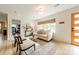 Bright living room, featuring a comfortable sofa and a wood accent wall at 531 Manhasset Rd, Charlotte, NC 28209