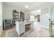 Bright home office with built-in shelving and French doors at 531 Manhasset Rd, Charlotte, NC 28209