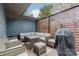 Relaxing patio area with wicker furniture and a privacy screen at 531 Manhasset Rd, Charlotte, NC 28209