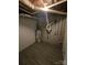 Unfinished basement area with water heater and exposed pipes at 5636 Sandhurst Rd, Hickory, NC 28602