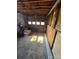 Unfinished garage with overhead door and concrete floor at 5636 Sandhurst Rd, Hickory, NC 28602