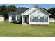Charming single-story home featuring a well-manicured front yard, red door, and classic shutters at 6328 W Nc 10 Hwy, Hickory, NC 28602