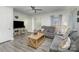 Living room with gray sectional sofa and large screen TV at 6328 W Nc 10 Hwy, Hickory, NC 28602
