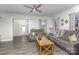 Open concept living room with gray sofas and wood flooring at 6328 W Nc 10 Hwy, Hickory, NC 28602