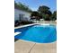 Backyard with a rectangular in-ground swimming pool, diving board and a deck, perfect for summer fun at 6328 W Nc 10 Hwy, Hickory, NC 28602
