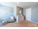 Neutral Bedroom with seating, changing table and storage at 9353 Creedmore Hills Dr, Charlotte, NC 28214