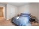 Spacious bedroom with a double bed, nightstands and access to the hallway at 9353 Creedmore Hills Dr, Charlotte, NC 28214
