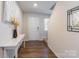 White console table sits in an entryway with hardwood floors at 9353 Creedmore Hills Dr, Charlotte, NC 28214