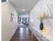 Bright entryway with hardwood floors and view into living room at 9353 Creedmore Hills Dr, Charlotte, NC 28214