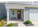 House entrance with brown door, small bench, and decorative wreath at 9353 Creedmore Hills Dr, Charlotte, NC 28214