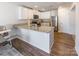 L-shaped kitchen with granite countertops and stainless steel appliances at 9353 Creedmore Hills Dr, Charlotte, NC 28214