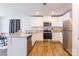 Modern kitchen with white cabinets, stainless steel appliances, and granite countertops at 9353 Creedmore Hills Dr, Charlotte, NC 28214