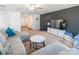 Living room with gray sectional sofa and marble-top coffee table at 9353 Creedmore Hills Dr, Charlotte, NC 28214