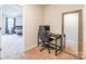 Small home office with a desk, chair, and large mirror at 9353 Creedmore Hills Dr, Charlotte, NC 28214