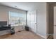Home office featuring a desk, window, and additional storage at 9353 Creedmore Hills Dr, Charlotte, NC 28214