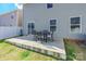 Concrete patio with seating area next to the house at 9353 Creedmore Hills Dr, Charlotte, NC 28214