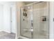 Clean and modern shower with glass enclosure and shelving at 9353 Creedmore Hills Dr, Charlotte, NC 28214