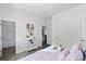 Bedroom with a queen bed, white shelving, and access to a bathroom at 109 E Broad St, Salisbury, NC 28144