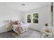 Spacious bedroom with a queen bed and neutral decor at 109 E Broad St, Salisbury, NC 28144