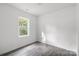 Bright bedroom featuring wood-look floors and a window at 109 E Broad St, Salisbury, NC 28144