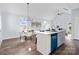 Dining area with black table, white chairs, and modern chandelier at 109 E Broad St, Salisbury, NC 28144