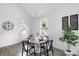 Bright dining area with a white table and black chairs, near a window at 109 E Broad St, Salisbury, NC 28144