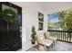 Inviting front porch with black door and two comfy chairs at 109 E Broad St, Salisbury, NC 28144