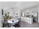 Open concept kitchen and dining area with granite countertops and modern appliances at 109 E Broad St, Salisbury, NC 28144