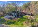 Aerial view of a modern home with lake access, decks and lush landscaping at 125 Chestnut Tree Rd, Mooresville, NC 28117