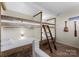 Unique bunk beds offer a fun sleeping space, complemented by rustic wood accents and decor at 125 Chestnut Tree Rd, Mooresville, NC 28117