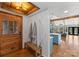 Welcoming entryway with light wood floors, a bench, coat hooks, and views into the home at 125 Chestnut Tree Rd, Mooresville, NC 28117