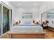 Bright and airy bedroom with a large bed, modern decor, and natural light at 125 Chestnut Tree Rd, Mooresville, NC 28117