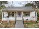 White cottage features a porch and walkway at 160 Brookwood Ne Ave, Concord, NC 28025