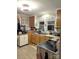 Kitchen with wood cabinets and double sink at 160 Brookwood Ne Ave, Concord, NC 28025