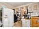 Galley kitchen, white cabinets, and appliances at 160 Brookwood Ne Ave, Concord, NC 28025