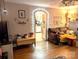 Living room with hardwood floors, fireplace and view into kitchen at 160 Brookwood Ne Ave, Concord, NC 28025