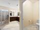Stylish bathroom with a glass shower, dual sinks and plenty of cabinet space at 1605 Appledale Ct # 116, Fort Mill, SC 29715