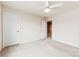 Clean and well-lit bedroom with neutral walls and carpet, featuring a ceiling fan and white doors at 1605 Appledale Ct # 116, Fort Mill, SC 29715