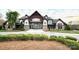 Elegant clubhouse with stone and wood accents, surrounded by manicured landscaping at 1605 Appledale Ct # 116, Fort Mill, SC 29715