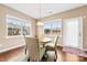 Bright dining area featuring hardwood floors, large windows, and stylish table with decorated chairs at 1605 Appledale Ct # 116, Fort Mill, SC 29715