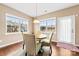 Bright dining area with large windows, dark hardwood floors, and cozy decor, creating a welcoming space for meals at 1605 Appledale Ct # 116, Fort Mill, SC 29715