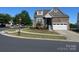 Two-story home on a corner lot with brick, siding, landscaping, and a two-car garage at 1605 Appledale Ct # 116, Fort Mill, SC 29715